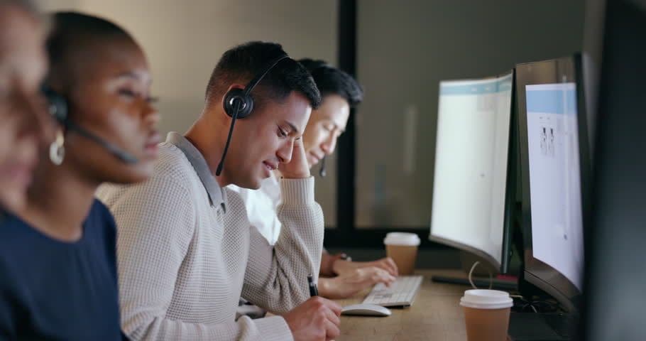 Support specialist using headset and computer